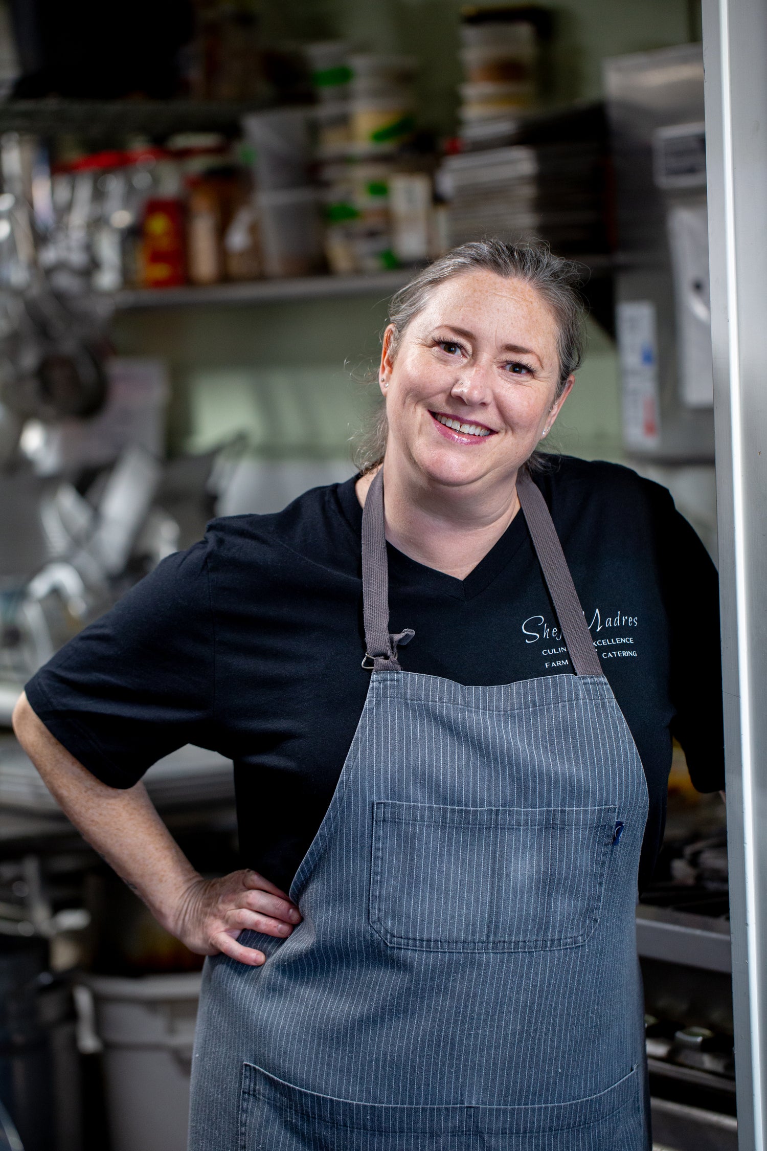 Chef Jennifer Millsap, owner and executive chef of Shef Madres Catering, in the kitchen preparing customized farm-to-table menus.