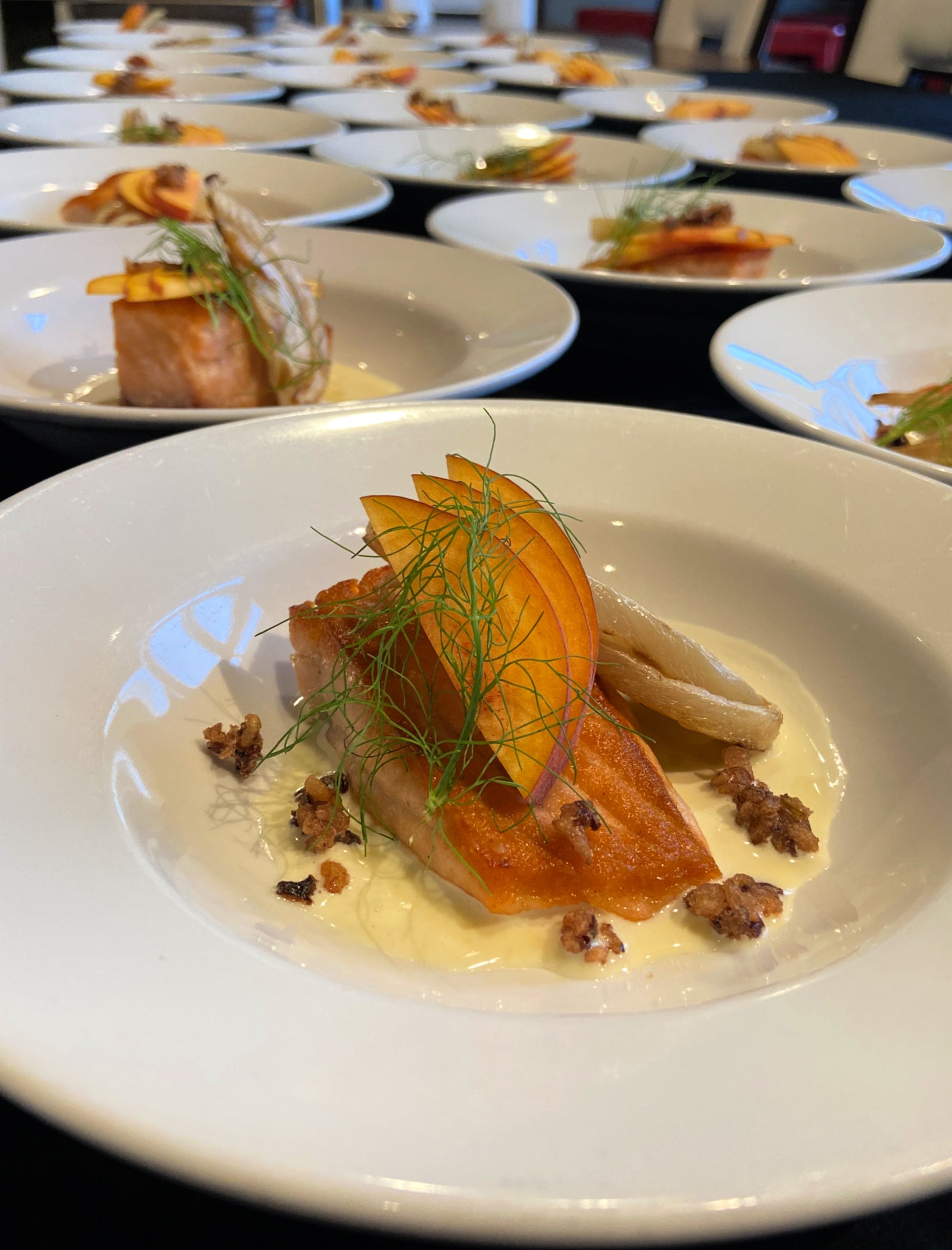Seasonal salmon entrée with roasted vegetables prepared by Shef Madres Catering for a Sacramento event.